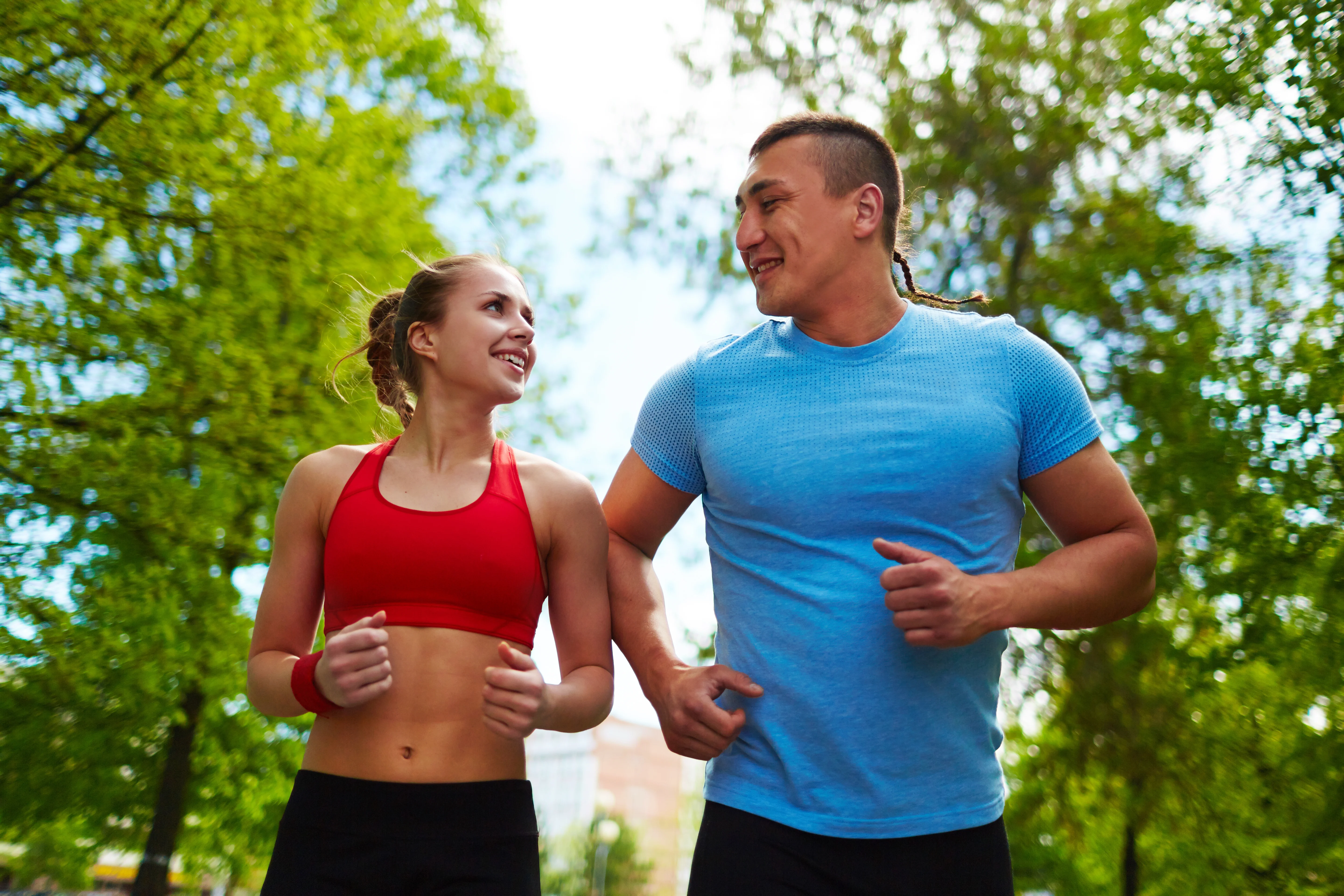 Active couple running - healthy lifestyle and prevention
